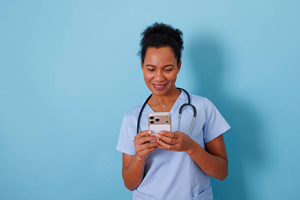 istock Healthcare professional browsing on smartphone, using mobile app for medical information or communication 2253861112