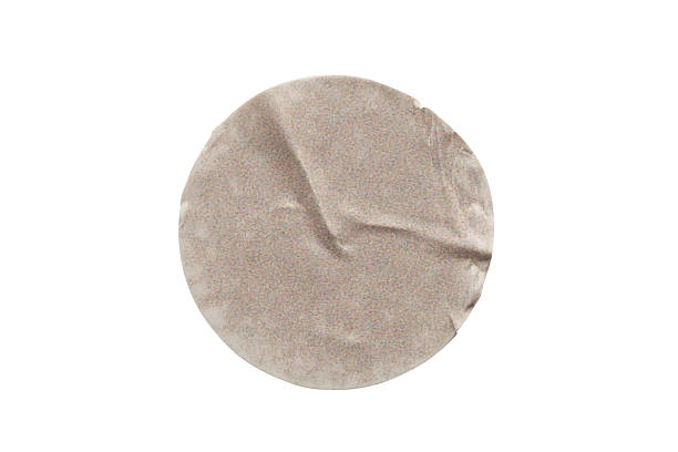 istock Blank brown round adhesive paper sticker label isolated on white background 2253862181
