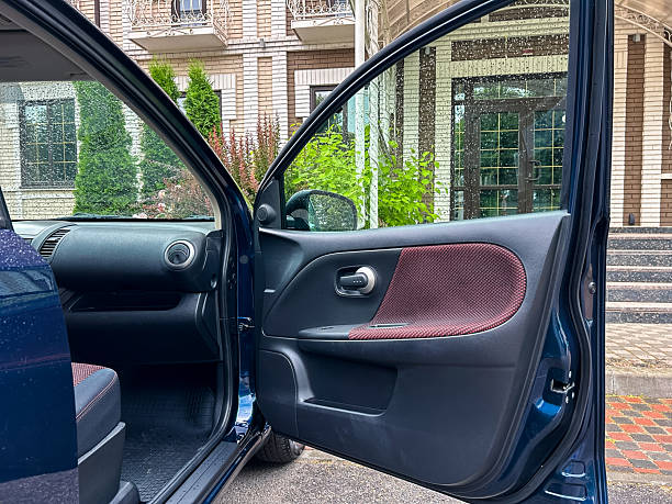 istock Explore the Stylish Car Interior through an elegantly opened door a captivating glimpse of comfort, sophistication, and elegance that elevates your driving experience on every adventure 2253864129