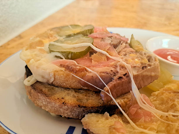 Sourdough Sandwich Corned Beef with bread, cheese, honey mustard, pickle cucumber, pickle onion and caramelized onion. Serving with spicy sauce. Food Menu.