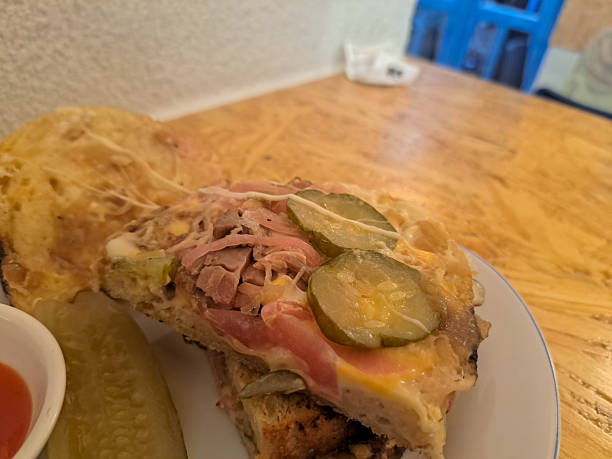 Sourdough Sandwich Corned Beef with bread, cheese, honey mustard, pickle cucumber, pickle onion and caramelized onion. Serving with spicy sauce. Food Menu.