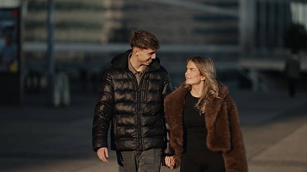 istock Young couple holding hands walking in Paris street 2253866549