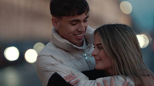 istock Romantic young couple embracing in Paris at night 2253867257
