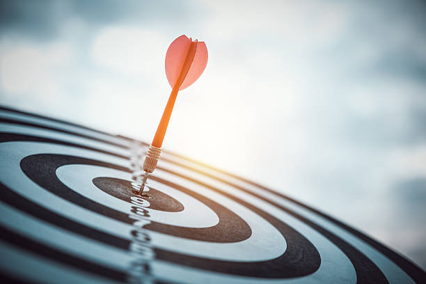 istock The successful dart precisely hitting the bullseye on a dartboard, symbolizing achievement, precision, and strategic planning for goals. 2253873675