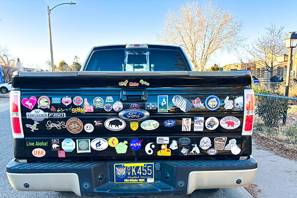 Santa Fe, NM:  A pickup truck parked in downtown Santa plastered with various bumper stickers, including for national parks such as Yellowstone, Grand Teton, and Arches.