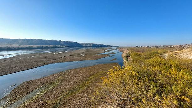 istock Majestic Soan River winding through Potohar plateau cliffs and sands 2253877108
