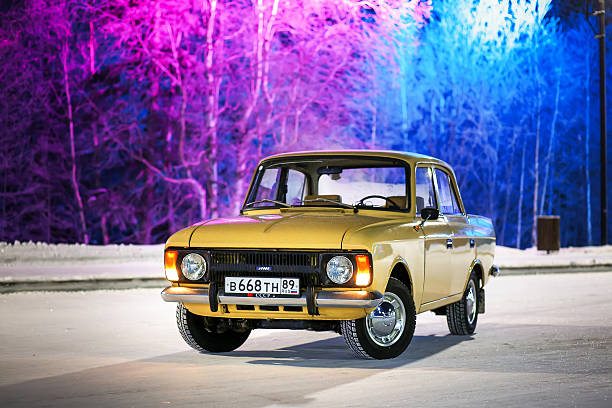 Novyy Urengoy, Russia - November 22, 2025: Classic Soviet saloon car Izh-Moskvich-412IE-028 in the city street.