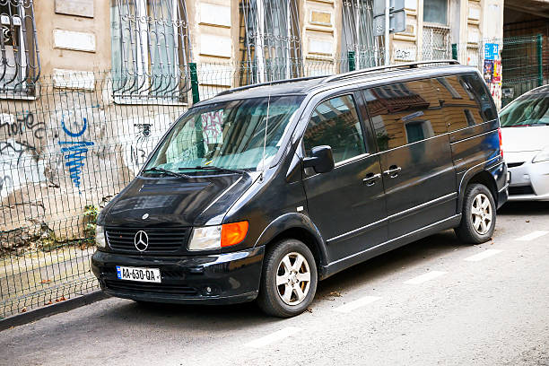 Torrelavega, Spain - 19 February, 2025: A Volkswagen Caravelle on a two lane highway
