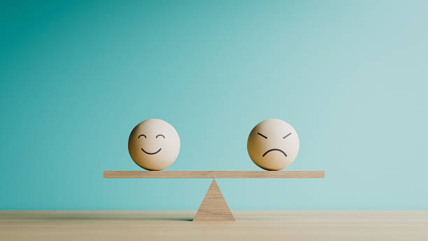 istock Happy and Angry Emoji Faces on Seesaw Balance Copy Space. 3d rendering 2253880632