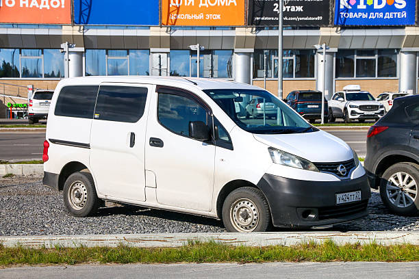 Novyy Urengoy, Russia - August 16, 2025: Small passenger van Nissan NV200 (M20) in the city street.