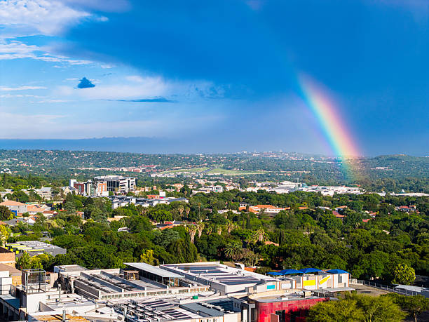 Rainbow over Cresta in Randburg city, shopping mall and residential district in Johannesburg.