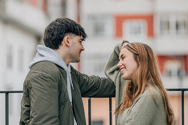 istock couple on the street talking intimately 2253882959