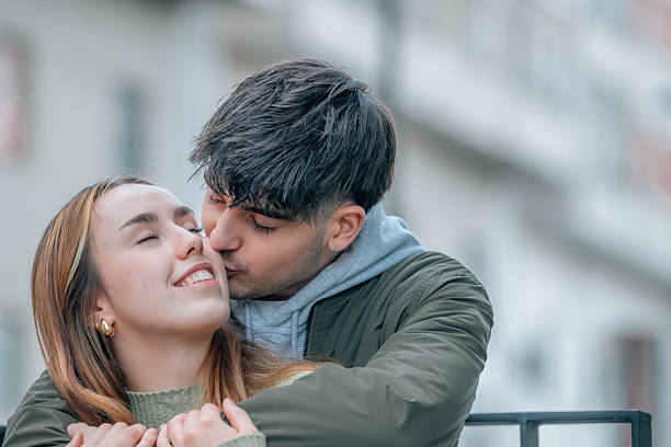wedding couple hugging on the street