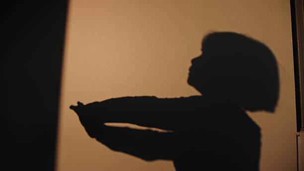 Shadow of a woman stretching in the morning.
