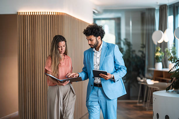 istock Business Professionals Discussing Solutions in Modern Office 2253886026