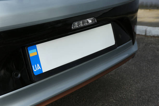 istock Car with vehicle registration plate outdoors, closeup 2253887316