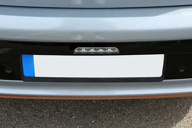 istock Car with vehicle registration plate outdoors, closeup 2253887331