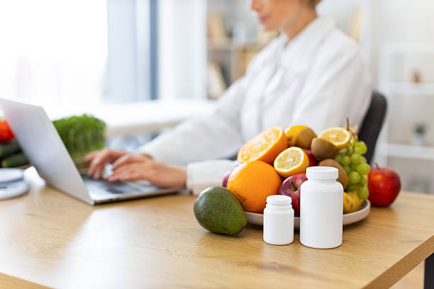 istock Nutritionist with Fruits and Supplements 2253889610