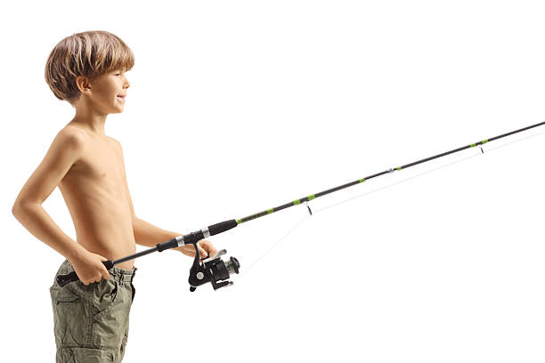 istock Boy catching fish with a fishing rod 2253891612