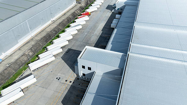 istock Aerial view modern warehouse for trucks unloading and loading, semi truck cargo trailer at logistic park warehouse, Distribution warehouse shipping supply chain, Business transportation logistic. 2253892682