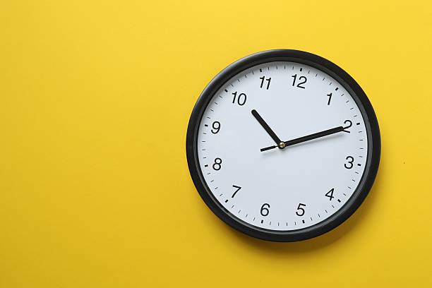 istock Big beautiful stylish clock on color background 2253893440
