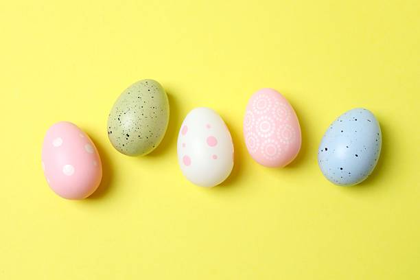 istock Happy Easter. Colorful eggs on color background, space for text or advertising 2253894983