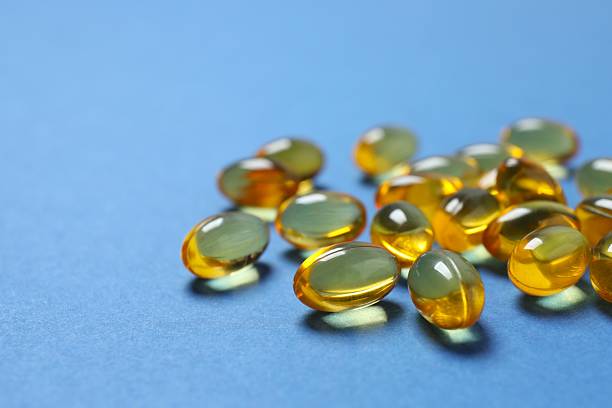 istock Fish oil tablets. Biologically active additives. Omega 3, 6, omega 9, vitamin A, E, D 2253895146