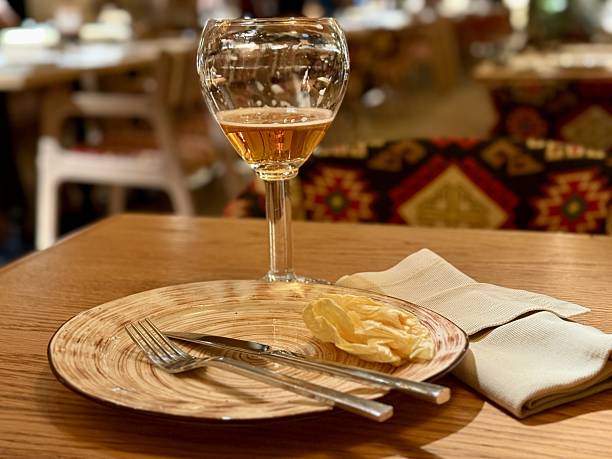 istock Quiet Restaurant With Vacant Table, Serene Setting With Unoccupied Plate And Drink, Calm Restaurant Scene Showcasing Untouched Plate Along With Drink In Tranquil Surroundings 2253905702