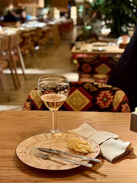 istock Quiet Restaurant With Vacant Table, Serene Setting With Unoccupied Plate And Drink, Calm Restaurant Scene Showcasing Untouched Plate Along With Drink In Tranquil Surroundings 2253905989