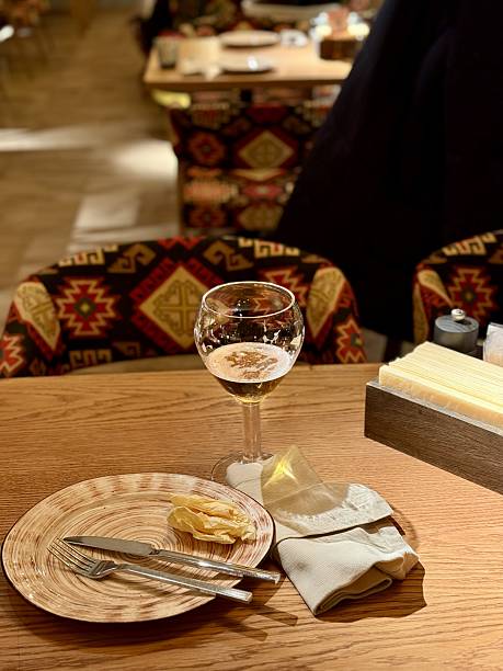 istock Quiet Restaurant With Vacant Table, Serene Setting With Unoccupied Plate And Drink, Calm Restaurant Scene Showcasing Untouched Plate Along With Drink In Tranquil Surroundings 2253906125