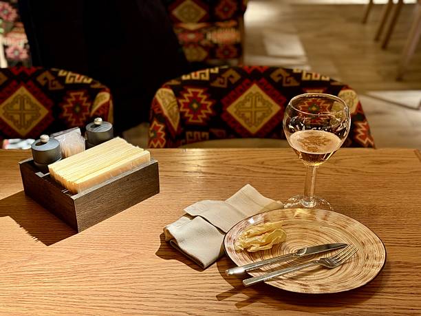 istock Quiet Restaurant With Vacant Table, Serene Setting With Unoccupied Plate And Drink, Calm Restaurant Scene Showcasing Untouched Plate Along With Drink In Tranquil Surroundings 2253906427