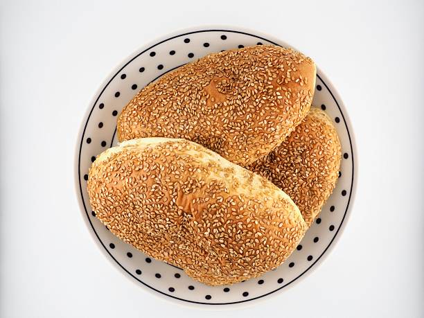 Sausage sandwich on a plate isolated on a white background.