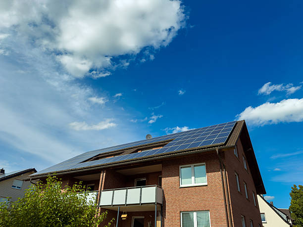 istock Bright solar panels gather sunlight on a modern building under a clear blue sky in an eco-friendly urban neighborhood 2253909173
