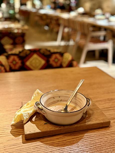 istock Homemade Soup In Rustic Setting, Peaceful Breakfast Featuring Cream Soup On Wooden Table, Serene Morning Meal Showcasing Ceramic Bowl With Leftover Soup On Rustic Wood Surface 2253909196