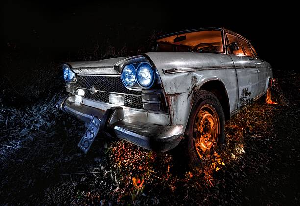 Vehicle abandoned in the countryside and illuminated with lanterns. High quality photo