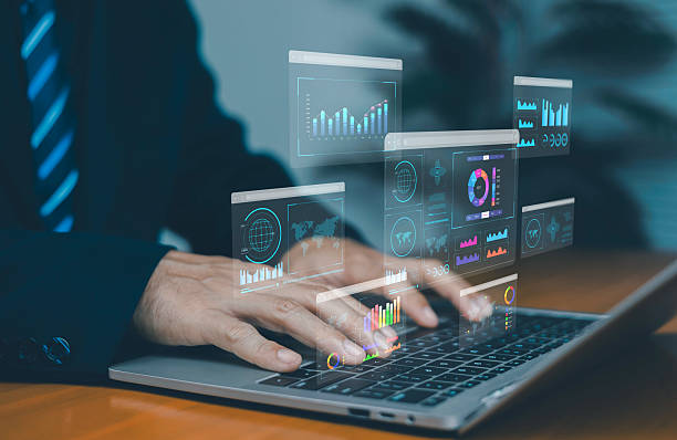 istock Businessman analyzing virtual data dashboards on laptop, showing business intelligence, analytics reports, financial charts, global data visualization, digital technology, and modern corporate. 2253910832