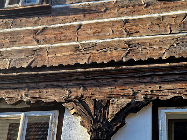 istock detail of a plinth, folk architecture, supporting element timbered, supporting upper floor. wooden structure with distinctive texture, carved. carvings rural architecture. construction is legacy of lo 2253910900