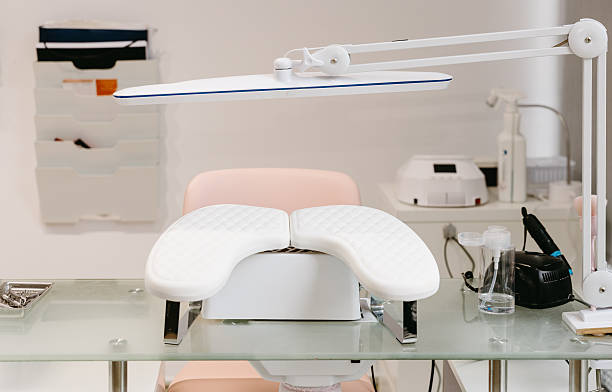 istock Empty manicure workstation at modern beauty salon with professional tools 2253913235