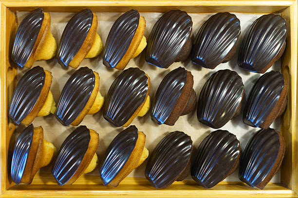 Chocolate Glazed Madeleines Arranged in Wooden Tray
