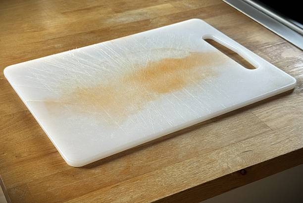 istock Worn Plastic Cutting Board with Scratches and Food Stains 2253914194