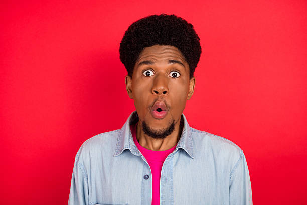istock Portrait of attractive cheerful curious brunet guy thinking copy empty space isolated over bright red color background 2253914610