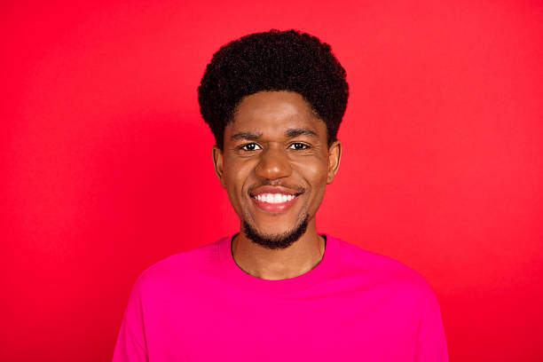 istock Portrait of attractive cheerful curious brunet guy thinking copy empty space isolated over bright red color background 2253914613