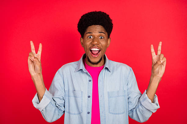 istock Portrait of attractive cheerful curious brunet guy thinking copy empty space isolated over bright red color background 2253914792