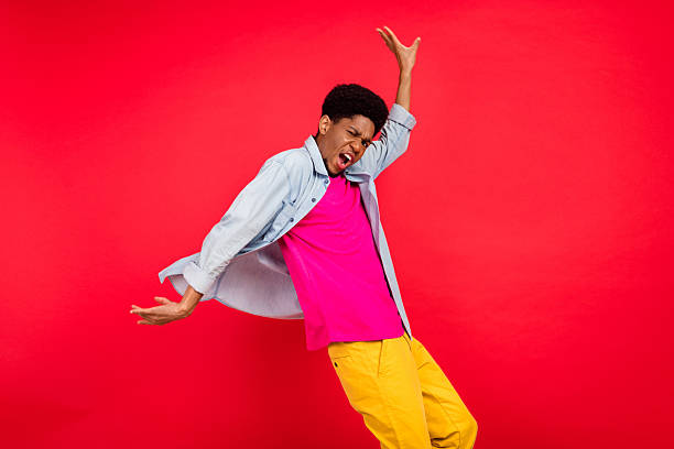 istock Portrait of attractive cheerful curious brunet guy thinking copy empty space isolated over bright red color background 2253914851