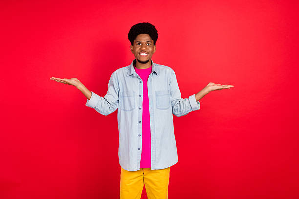 istock Portrait of attractive cheerful curious brunet guy thinking copy empty space isolated over bright red color background 2253914876