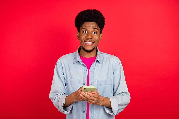 istock Portrait of attractive cheerful curious brunet guy thinking copy empty space isolated over bright red color background 2253914908