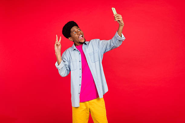 istock Portrait of attractive cheerful curious brunet guy thinking copy empty space isolated over bright red color background 2253914927