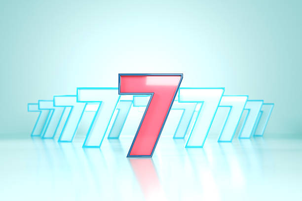 Pink And Blue Number 7 On Blue Background. Finance and Data Concept.