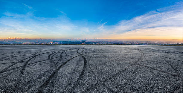 istock Asphalt road and sky clouds background 2253918422