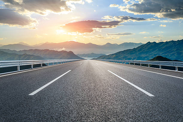 istock Asphalt road and mountain background 2253918462